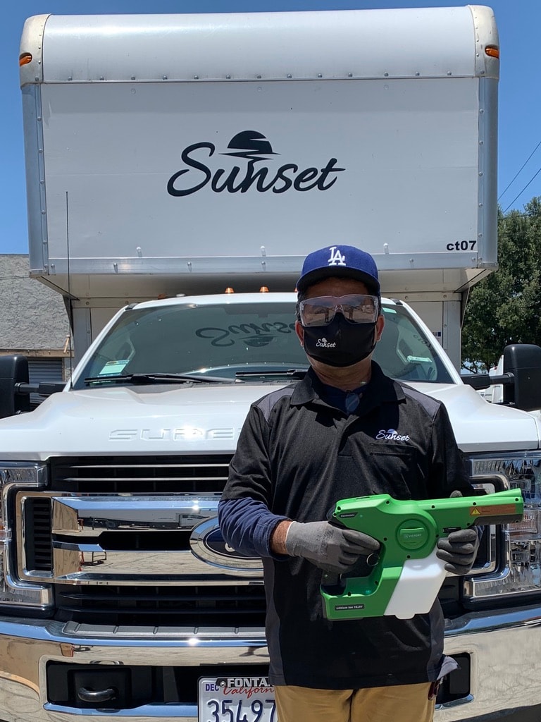 Mat Men crew member with Sunset truck on set