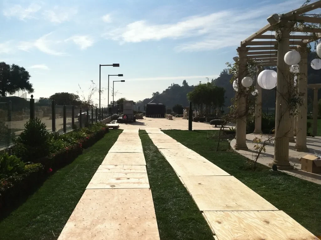 Mat Men protecting park pathway on location