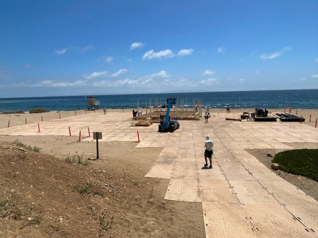 Mat Men protecting beach boardwalk on location