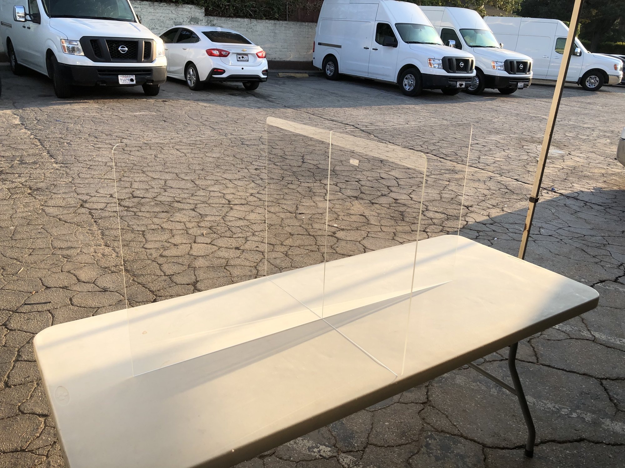 Acrylic table divider on folding table